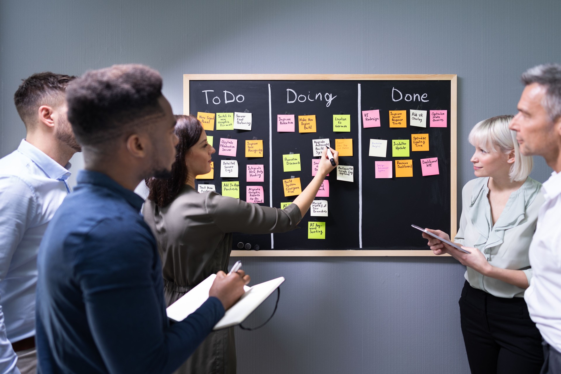 Group Of People Writing On Sticky Notes
